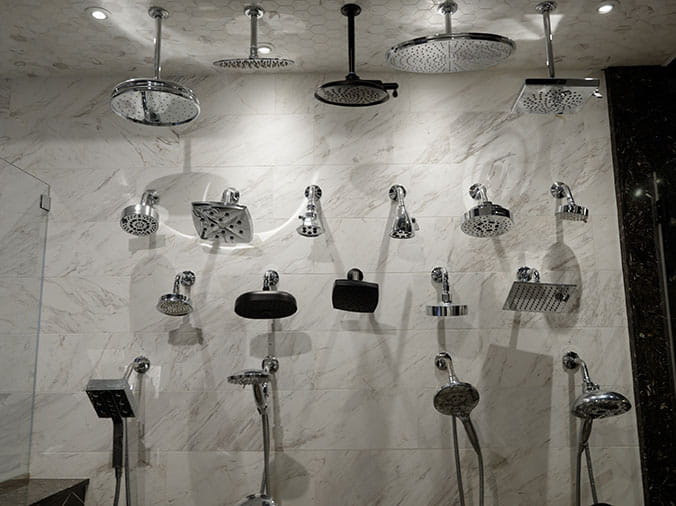 Various shower heads oin display at Green Art Plumbing Supply Showroom Freeport