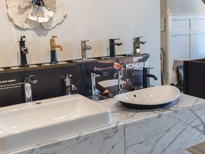 Bathroom faucets on display at Green Art Plumbing Supply Freeport