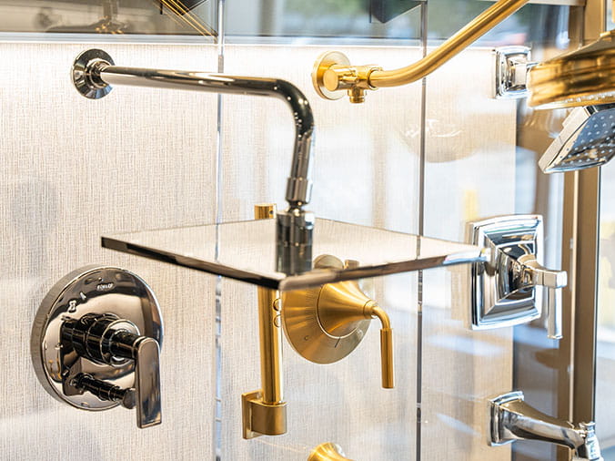 Shower hardware display at Green Art Plumbing Supply Freeport
