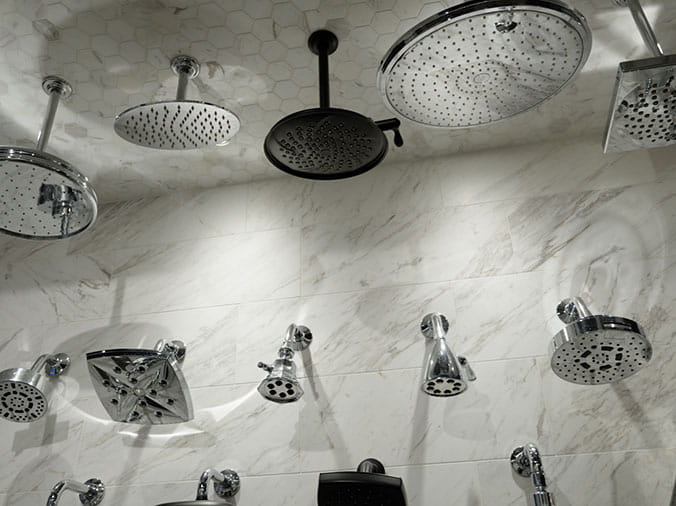 Shower head display at Green Art Plumbing Supply Freeport